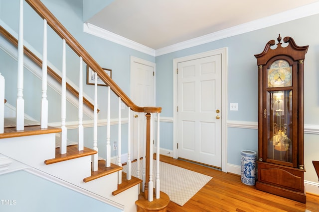 1610 Ridge Rd, Raleigh, NC 27607 - foyer featuring wood finished floors, stairs, and ornamental molding