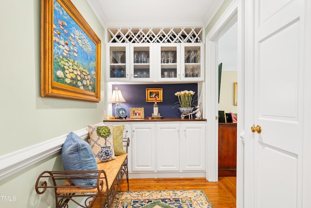 1610 Ridge Rd, Raleigh, NC 27607 - indoor bar featuring light wood-style floors and crown molding