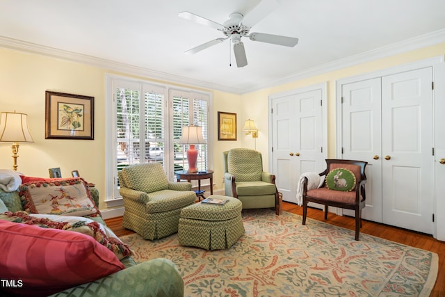1610 Ridge Rd, Raleigh, NC 27607 - living area with wood finished floors, crown molding, and ceiling fan