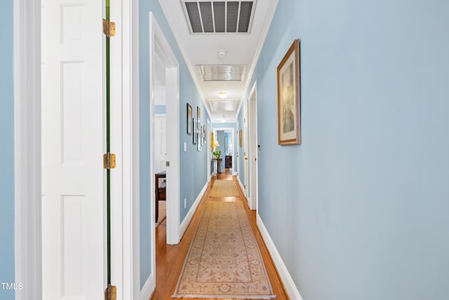 1610 Ridge Rd, Raleigh, NC 27607 - hall featuring attic access, light wood-type flooring, and crown molding