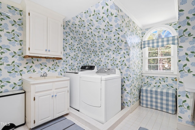 1610 Ridge Rd, Raleigh, NC 27607 - laundry area with wallpapered walls, washer and dryer, light tile patterned floors, and cabinet space