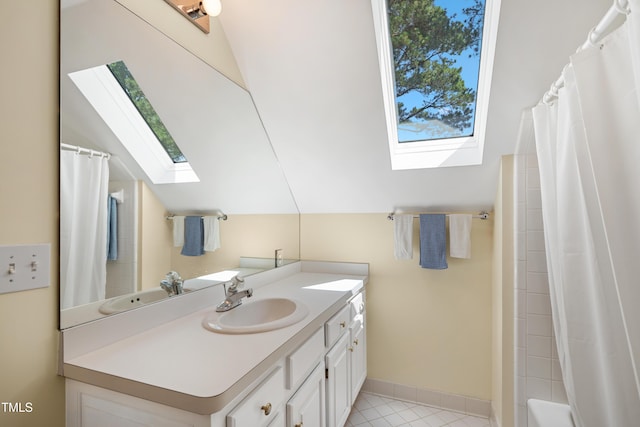 1610 Ridge Rd, Raleigh, NC 27607 - bathroom featuring a skylight, vanity, tile patterned floors, and shower / bathtub combination with curtain