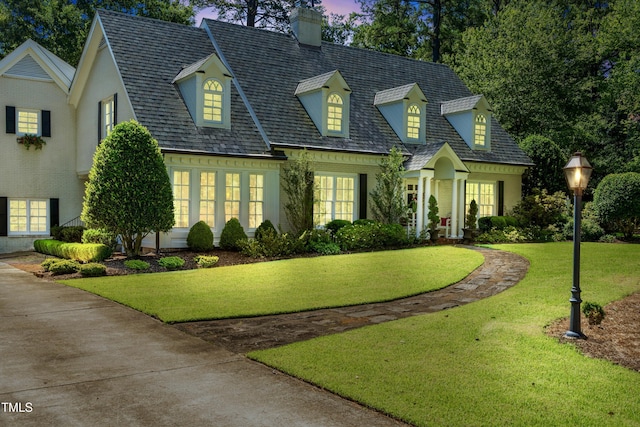 1610 Ridge Rd, Raleigh, NC 27607 - cape cod house featuring a chimney and a yard