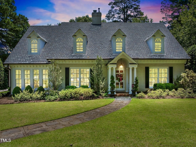 1610 Ridge Rd, Raleigh, NC 27607 - view of front of house featuring a chimney, brick siding, and a front lawn