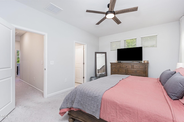 2866 Hunter Woods Dr, Apex, NC 27502 - bedroom featuring light carpet, multiple windows, and ceiling fan