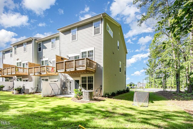 2866 Hunter Woods Dr, Apex, NC 27502 - rear view of house featuring a yard and a deck