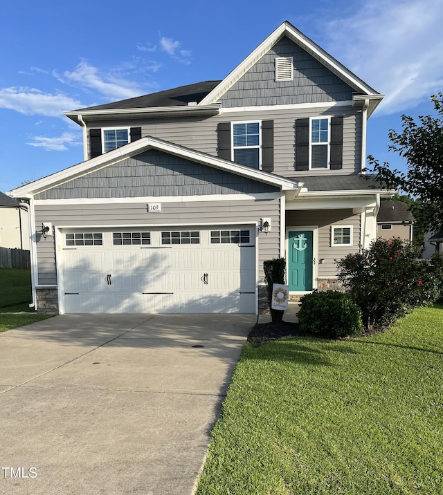 109 E Webber Ln, Clayton, NC 27527 - view of front of house with concrete driveway, stone siding, a garage, and a front lawn