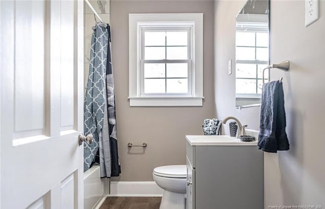 817 Aberdeen Rd, Laurinburg, NC 28352 - bathroom with vanity, wood finished floors, and shower / tub combo
