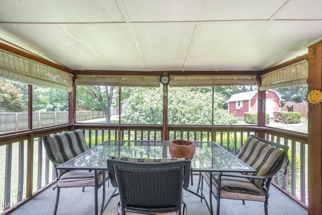 1822 Atterbury Ln, Durham, NC 27712 - sunroom / solarium featuring outdoor dining area
