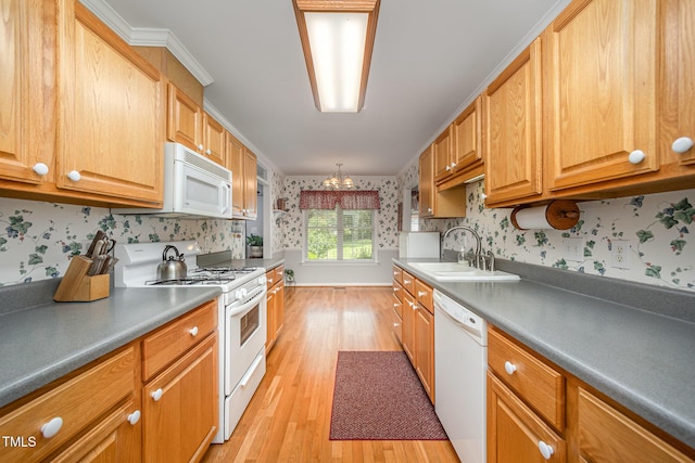 1822 Atterbury Ln, Durham, NC 27712 - kitchen with white appliances, wallpapered walls, light wood-style flooring, a chandelier, and crown molding
