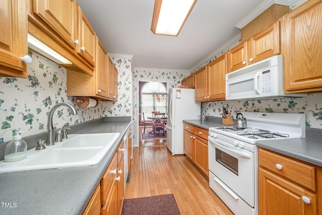 1822 Atterbury Ln, Durham, NC 27712 - kitchen with white appliances, wallpapered walls, light wood-style floors, crown molding, and dark countertops
