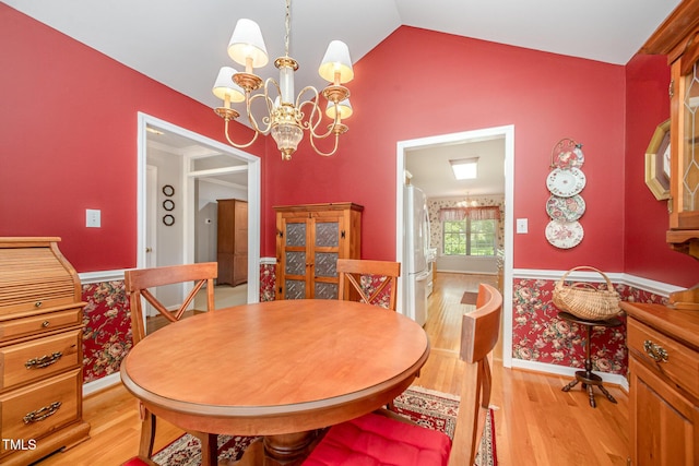 1822 Atterbury Ln, Durham, NC 27712 - dining room featuring light wood-type flooring, a chandelier, and lofted ceiling