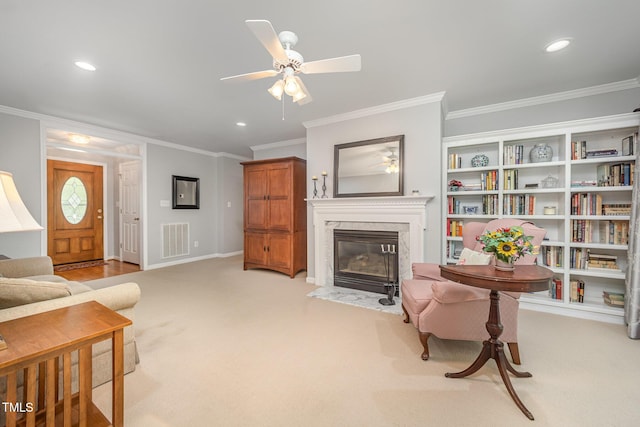 1822 Atterbury Ln, Durham, NC 27712 - living room featuring crown molding, ceiling fan, a premium fireplace, light colored carpet, and recessed lighting