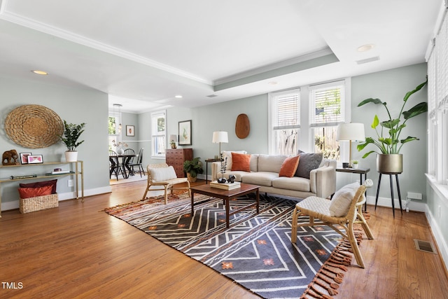 2804 Barmettler St, Raleigh, NC 27607 - living room with wood finished floors, crown molding, recessed lighting, and a raised ceiling