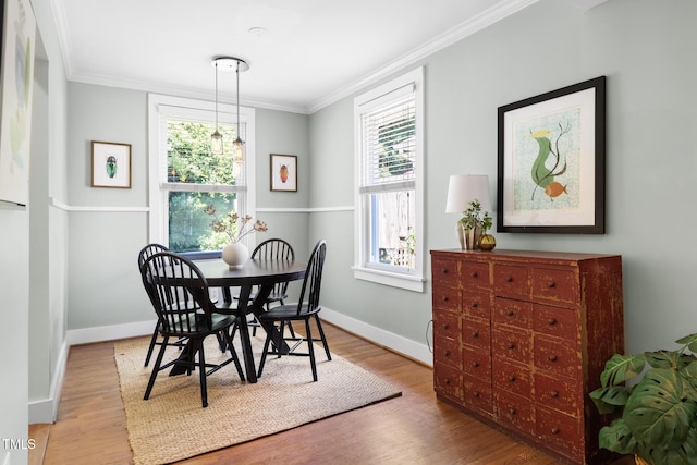 2804 Barmettler St, Raleigh, NC 27607 - dining area with crown molding, plenty of natural light, and wood finished floors