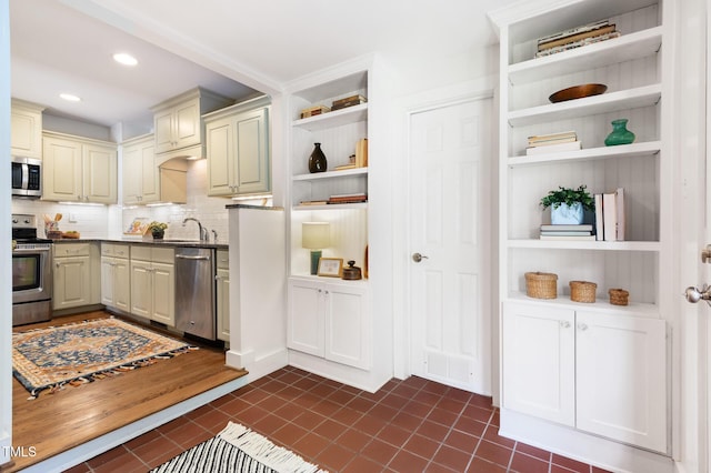 2804 Barmettler St, Raleigh, NC 27607 - kitchen featuring stainless steel appliances, open shelves, dark tile patterned flooring, tasteful backsplash, and recessed lighting