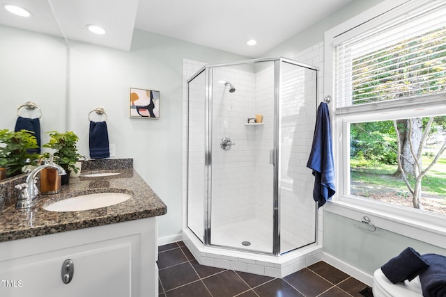 2804 Barmettler St, Raleigh, NC 27607 - full bathroom with a stall shower, double vanity, tile patterned floors, and recessed lighting