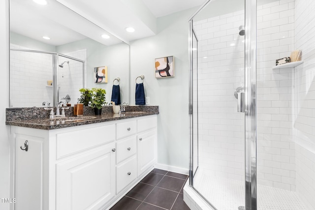 2804 Barmettler St, Raleigh, NC 27607 - bathroom with double vanity, a shower stall, tile patterned flooring, and recessed lighting