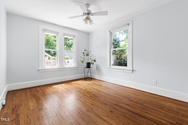 2804 Barmettler St, Raleigh, NC 27607 - spare room featuring healthy amount of natural light, wood finished floors, and ceiling fan