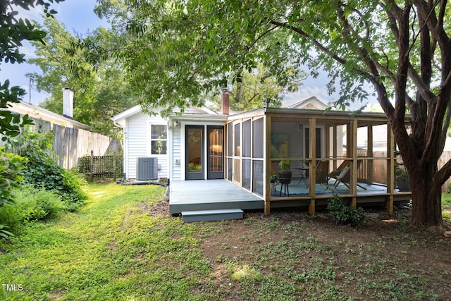 2804 Barmettler St, Raleigh, NC 27607 - back of property featuring a sunroom, a wooden deck, and a chimney