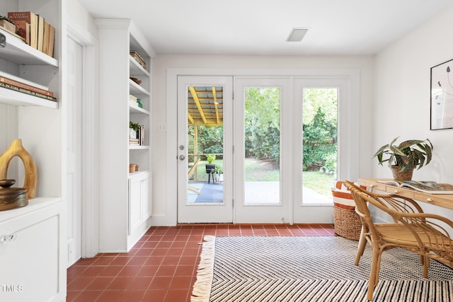 2804 Barmettler St, Raleigh, NC 27607 - entryway with healthy amount of natural light and dark tile patterned flooring