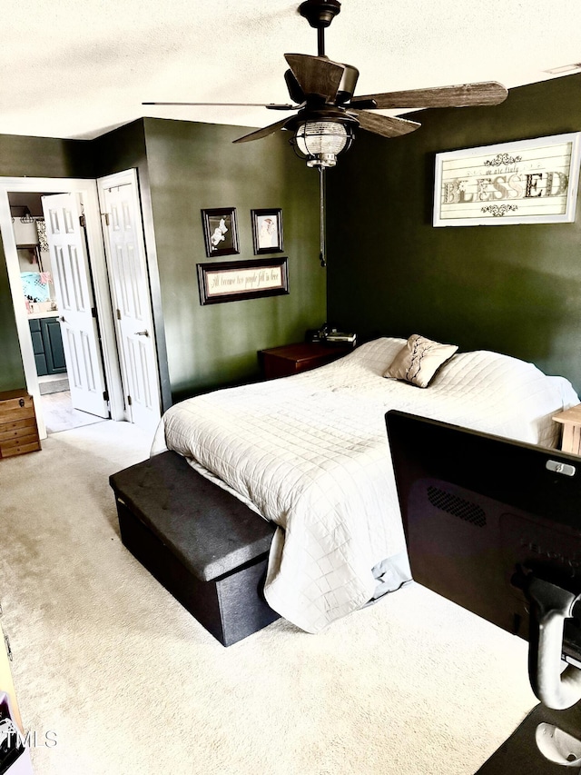 4117 Mangrove Dr, Raleigh, NC 27616 - bedroom with carpet, ensuite bath, and a ceiling fan