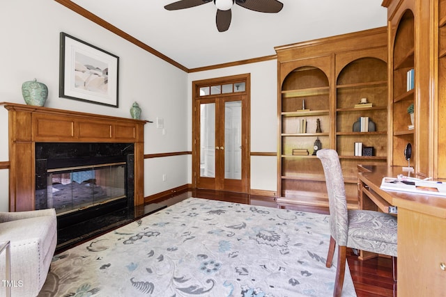 5106 Stockton Way, Durham, NC 27707 - office space with crown molding, a ceiling fan, wood finished floors, a fireplace, and built in shelves