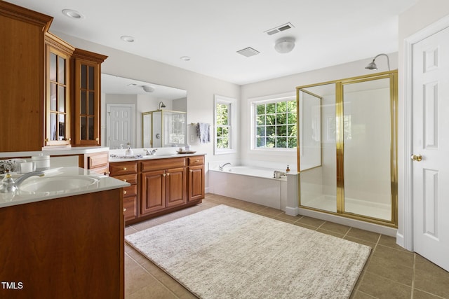 5106 Stockton Way, Durham, NC 27707 - full bath featuring a shower stall, two vanities, tile patterned flooring, and a bath