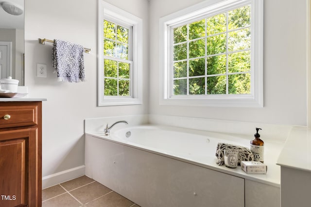 5106 Stockton Way, Durham, NC 27707 - full bathroom with vanity, healthy amount of natural light, a garden tub, and tile patterned floors