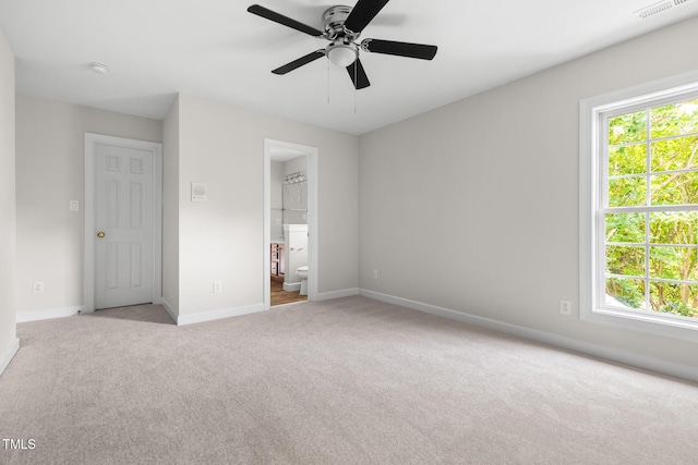 5106 Stockton Way, Durham, NC 27707 - unfurnished bedroom with carpet, multiple windows, ensuite bathroom, and a ceiling fan