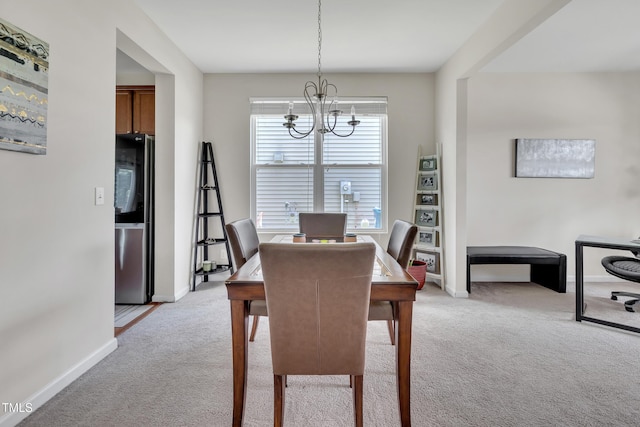 2123 Scarlet Sage Dr, Durham, NC 27704 - dining space with a chandelier, light carpet, and a desk