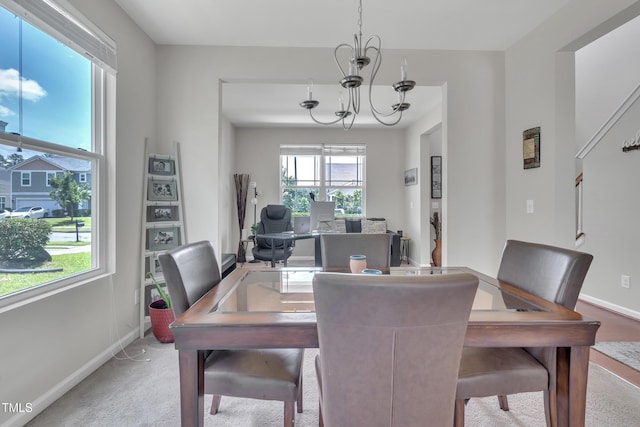 2123 Scarlet Sage Dr, Durham, NC 27704 - dining space featuring a chandelier and carpet flooring