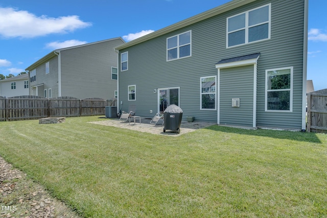 2123 Scarlet Sage Dr, Durham, NC 27704 - rear view of house featuring a fenced backyard, a patio area, and a fire pit