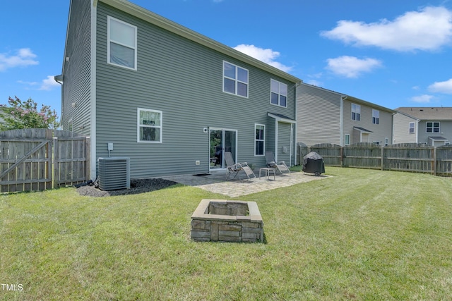 2123 Scarlet Sage Dr, Durham, NC 27704 - back of house with a fire pit, a fenced backyard, and a patio