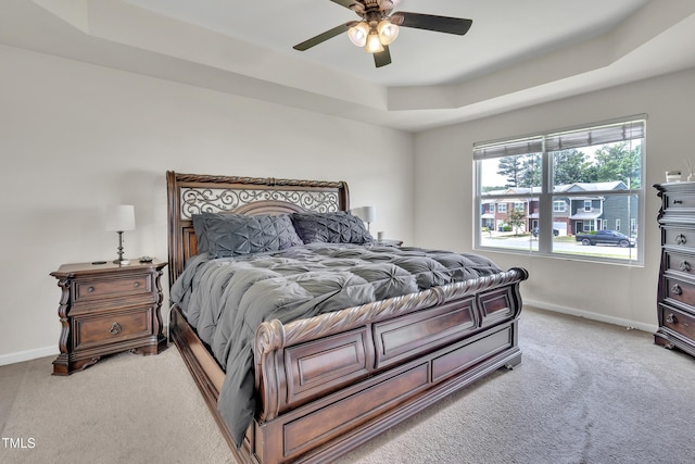 2123 Scarlet Sage Dr, Durham, NC 27704 - bedroom with light carpet, a raised ceiling, and a ceiling fan