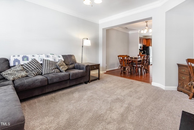 8823 Orchard Grove Way, Raleigh, NC 27612 - living area featuring carpet flooring, a chandelier, and ornamental molding