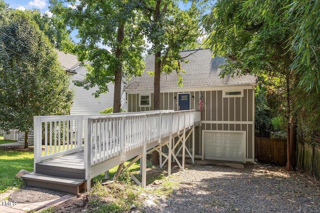 1309 Hill St, Durham, NC 27707 - back of property with a shingled roof, a wooden deck, and a garage