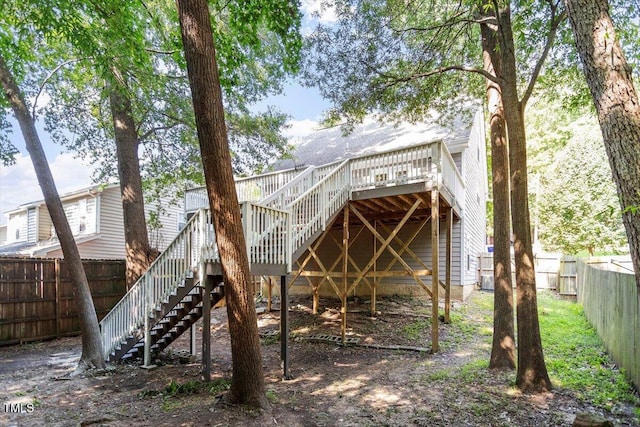 1309 Hill St, Durham, NC 27707 - back of property featuring stairs, a fenced backyard, and a deck