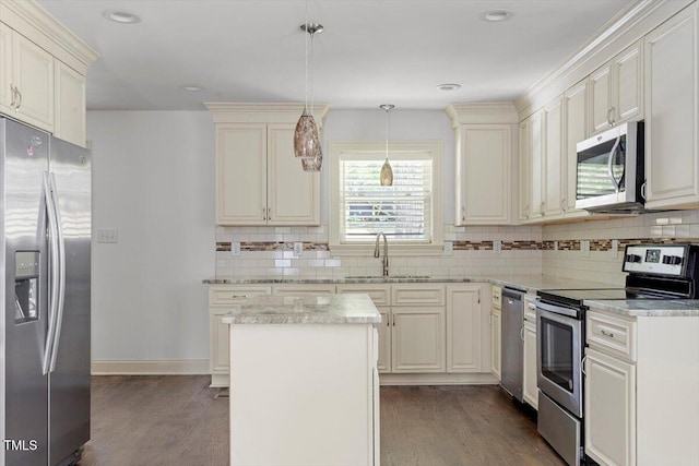 1309 Hill St, Durham, NC 27707 - kitchen with appliances with stainless steel finishes, dark wood finished floors, decorative backsplash, and recessed lighting