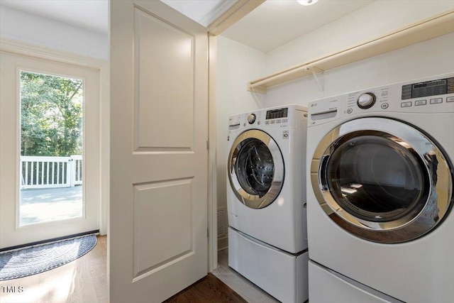 1309 Hill St, Durham, NC 27707 - washroom featuring washing machine and clothes dryer and dark wood-type flooring