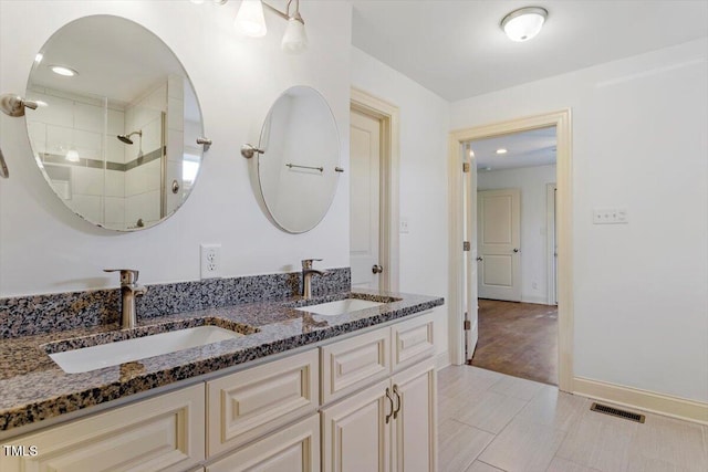 1309 Hill St, Durham, NC 27707 - bathroom with double vanity, tile patterned flooring, and a shower