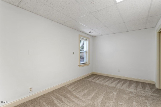 1309 Hill St, Durham, NC 27707 - carpeted spare room with a paneled ceiling and baseboards