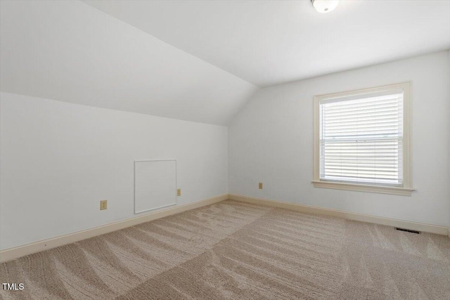 1309 Hill St, Durham, NC 27707 - additional living space featuring vaulted ceiling and light colored carpet