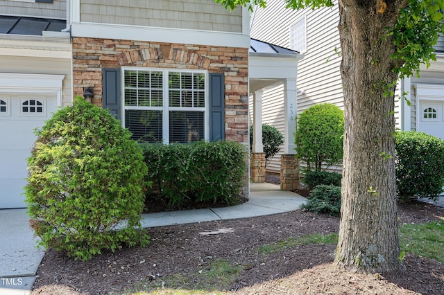 238 Royal Tower Way, Cary, NC 27513 - view of property exterior featuring stone siding and a garage
