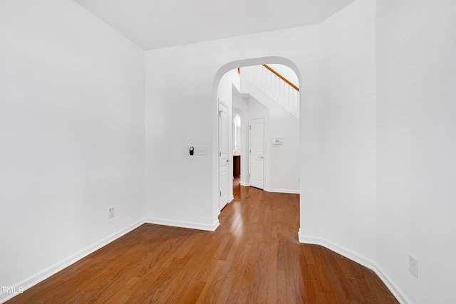 238 Royal Tower Way, Cary, NC 27513 - spare room with arched walkways and wood finished floors