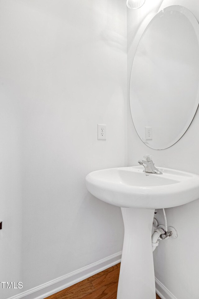 238 Royal Tower Way, Cary, NC 27513 - bathroom with baseboards and wood finished floors