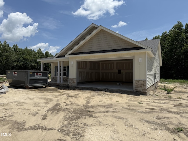 4026 N NC-581 Hwy, Kenly, NC 27542 - view of front facade featuring stone siding and a garage