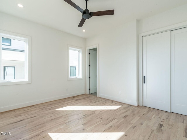 1009 Parker St, Raleigh, NC 27607 - unfurnished bedroom featuring light wood finished floors, recessed lighting, a ceiling fan, and a closet