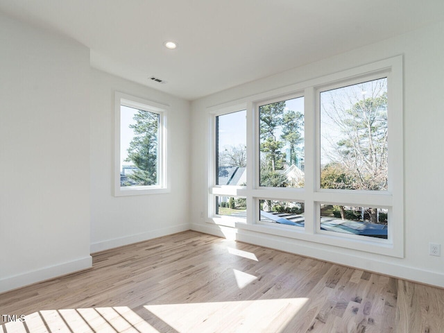1009 Parker St, Raleigh, NC 27607 - spare room featuring wood finished floors and recessed lighting