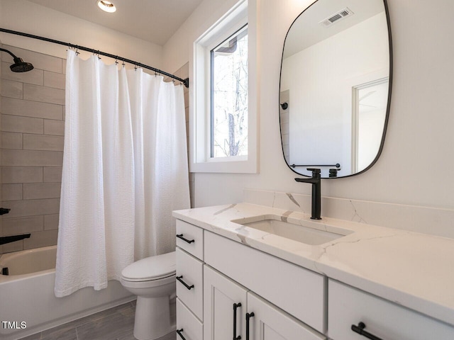 1009 Parker St, Raleigh, NC 27607 - bathroom featuring vanity, shower / bath combo, and wood finished floors